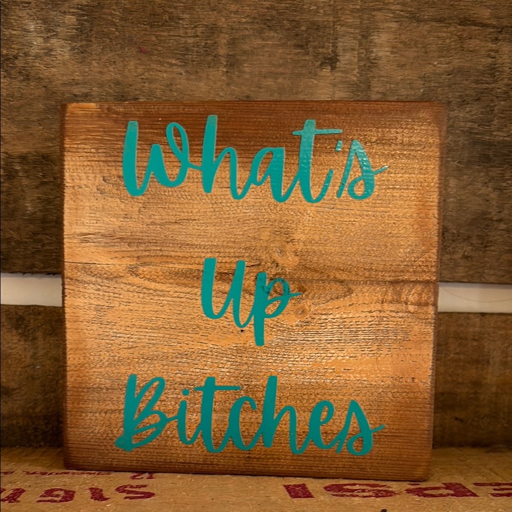 Wooden Sign with Teal Text